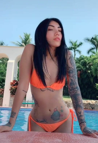 Nicole Amado (@amadorat) #tattooed body  #bikini  #electric orange bikini  #swimming pool  «Coño»