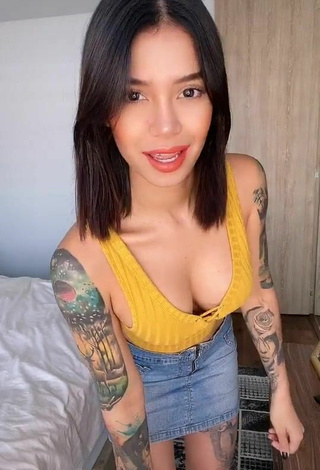 Jenn Muriel (@jennmuriel) #cleavage  #tattooed body  #crop top  #yellow crop top  #skirt  #jeans skirt 