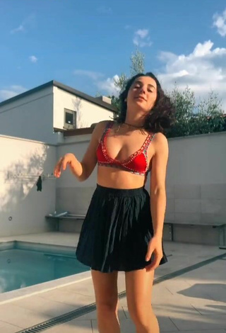 Ludovica Olgiati (@ludovicaolgiati) #bikini top  #red bikini top  #cleavage  #skirt  #black skirt  #booty shaking  «☀️ Mare o piscina?...»
