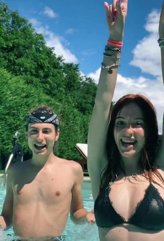 Anna Ciati (@annaroseciati) #bikini top  #black bikini top  #cleavage  #belly button piercing  #wet  #swimming pool 