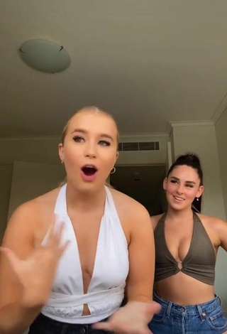 Caitlin Cummins (@caitlincmmins) #bodysuit  #white bodysuit  #crop top  #olive crop top  #cleavage  «#stitch with @lucyhelenaa what a...»