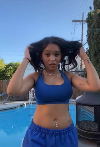River Bleu (@riverbleu) #cleavage  #crop top  #blue crop top  #belly button piercing  #tattooed body  #swimming pool  «don’t run away from the truth»