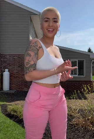 Thalya Rodriguez (@yourfavthalya) #tattooed body  #crop top  #white crop top  #pants  #pink pants  «I’m no tiktok dancer   but ya...»