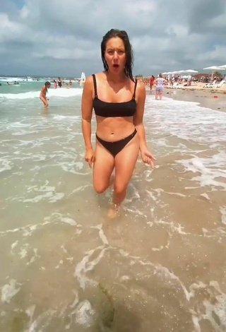 Liza (@lizzeasy) #beach  #bikini  #black bikini  #cleavage  #legs 