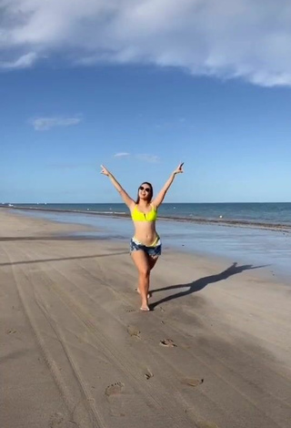 Mirela Janis (@mirelajanis) #beach  #shorts  #jeans shorts  #bikini  #yellow bikini  «Fazendo a dancinha viral dos...»
