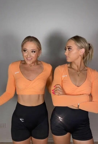 Sam & Teagan Rybka (@rybkatwinsofficial) #crop top  #orange crop top  #shorts  «Maybe? Kind of...   We just...»